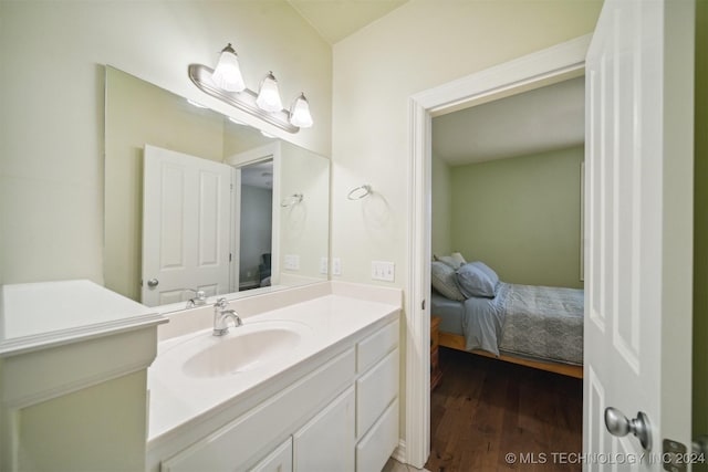 bathroom featuring vanity and hardwood / wood-style flooring