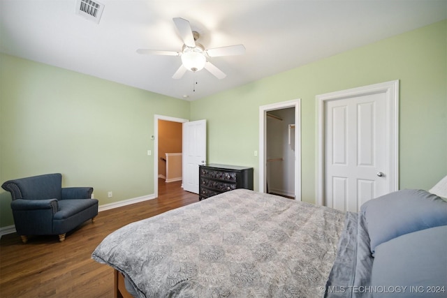 bedroom featuring ceiling fan and dark wood-type flooring