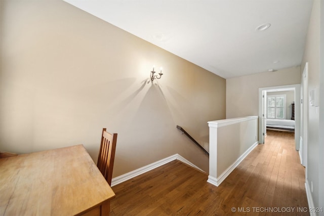 hall with wood-type flooring