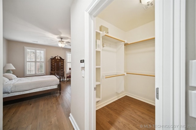 bedroom with hardwood / wood-style flooring and ceiling fan