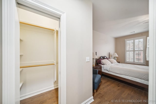 bedroom with hardwood / wood-style flooring