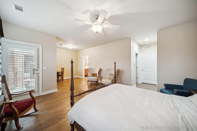 bedroom with hardwood / wood-style flooring and ceiling fan