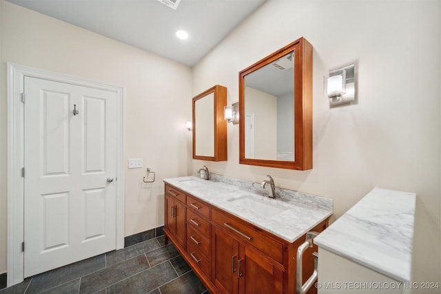 bathroom featuring tile patterned flooring and vanity