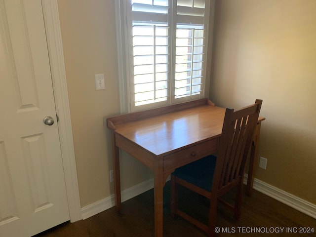 dining room with dark hardwood / wood-style flooring