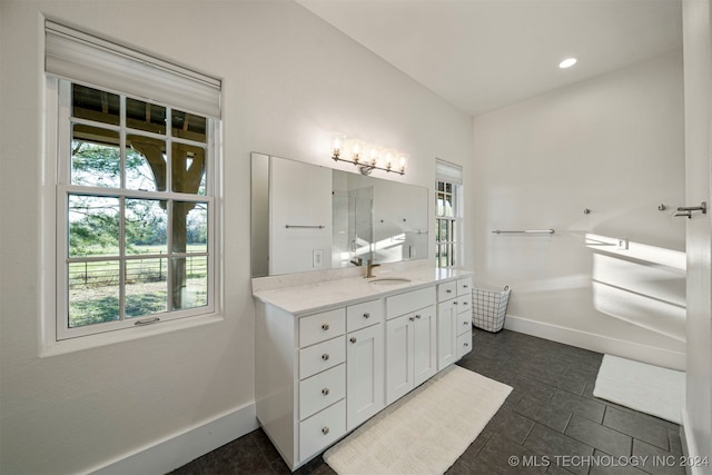 bathroom with tile patterned floors and vanity