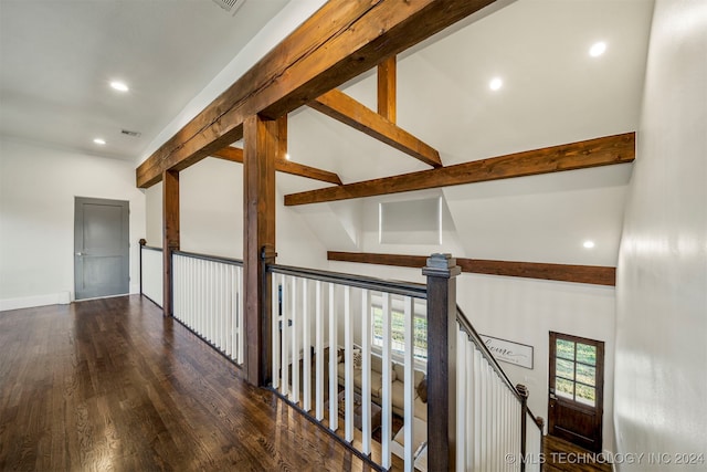 hallway with beamed ceiling, dark hardwood / wood-style floors, and high vaulted ceiling