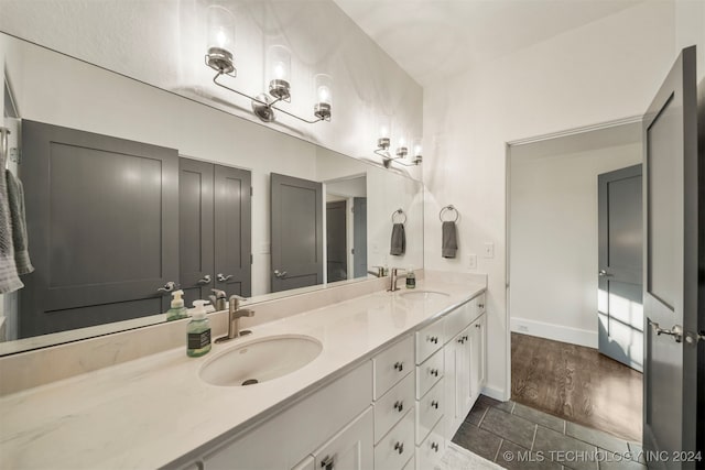 bathroom featuring hardwood / wood-style floors and vanity