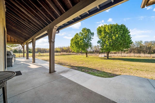 view of patio / terrace featuring area for grilling and a rural view