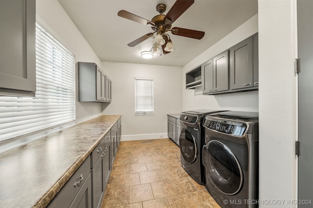 laundry room with a healthy amount of sunlight, ceiling fan, cabinets, and independent washer and dryer