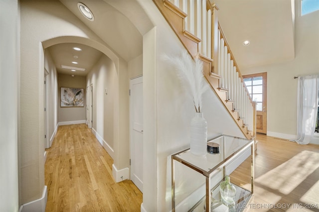 hall with light hardwood / wood-style flooring