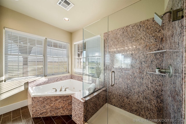 bathroom featuring plus walk in shower