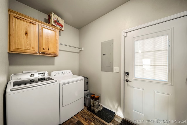 clothes washing area with cabinets, dark hardwood / wood-style floors, washing machine and dryer, and electric panel