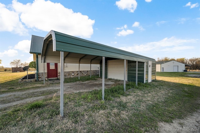 view of parking / parking lot with a carport and a lawn