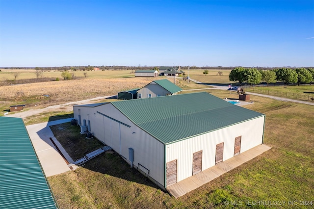 birds eye view of property with a rural view