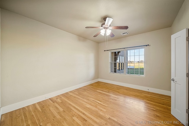 empty room featuring ceiling fan and light hardwood / wood-style floors