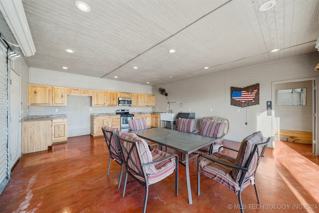 dining area with concrete flooring