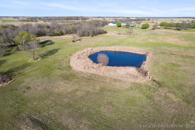 drone / aerial view with a rural view and a water view