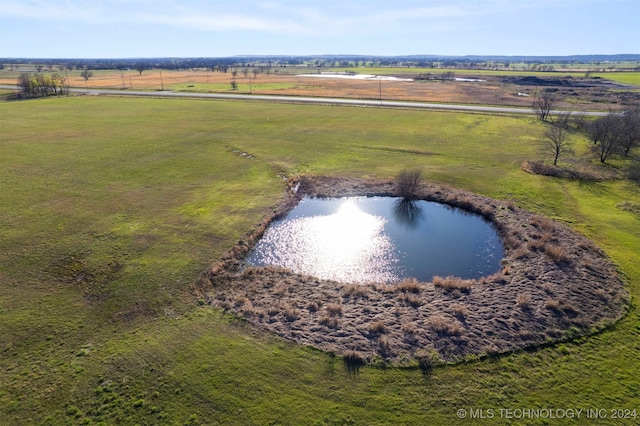 aerial view featuring a rural view and a water view