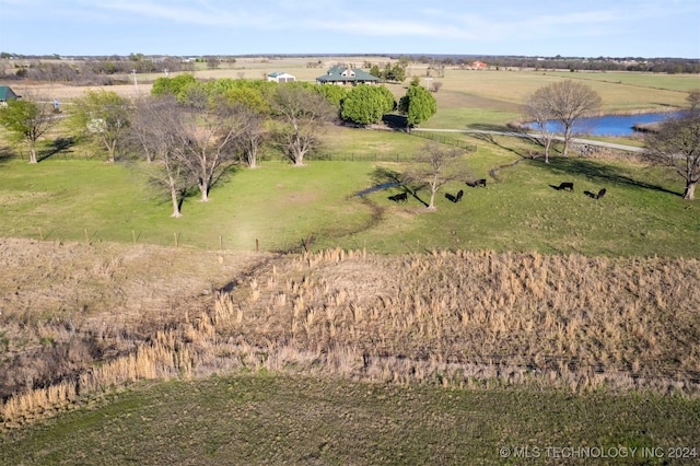 aerial view with a water view and a rural view