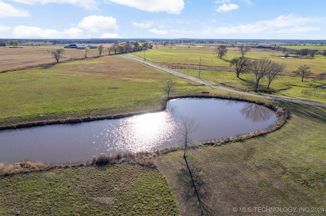 birds eye view of property featuring a rural view and a water view