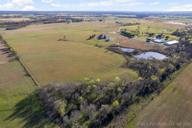 drone / aerial view featuring a rural view and a water view