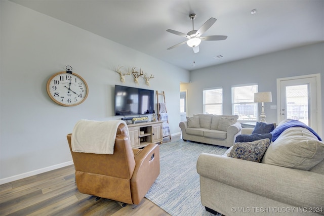 living room with hardwood / wood-style floors and ceiling fan