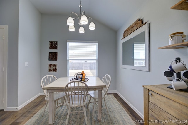 dining area featuring a chandelier, dark hardwood / wood-style flooring, and vaulted ceiling