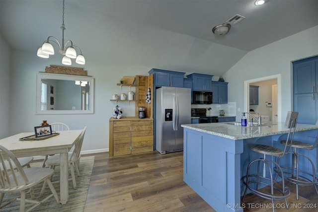 kitchen featuring light stone countertops, sink, dark wood-type flooring, vaulted ceiling, and black appliances