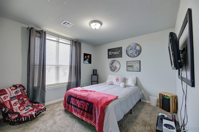 bedroom featuring light carpet