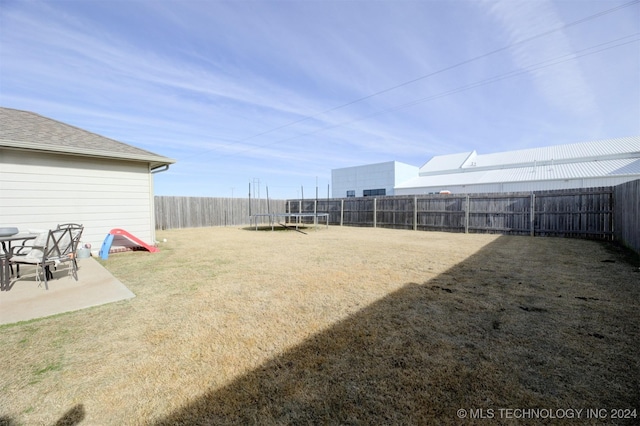 view of yard featuring a trampoline