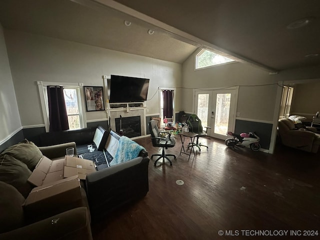 living room with hardwood / wood-style floors, vaulted ceiling with beams, a wealth of natural light, and french doors