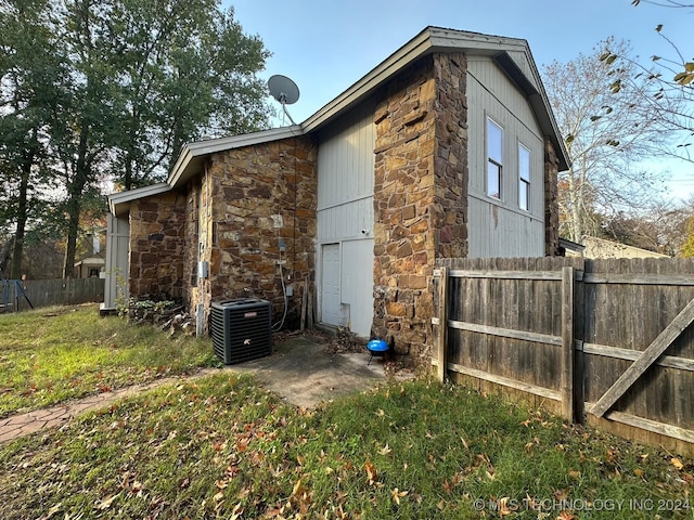 view of side of property featuring cooling unit