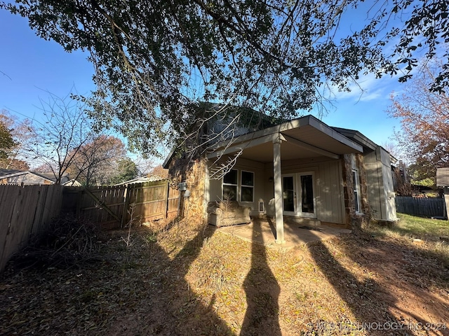 back of house featuring french doors