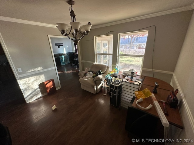 dining space with dark hardwood / wood-style flooring, ornamental molding, and an inviting chandelier