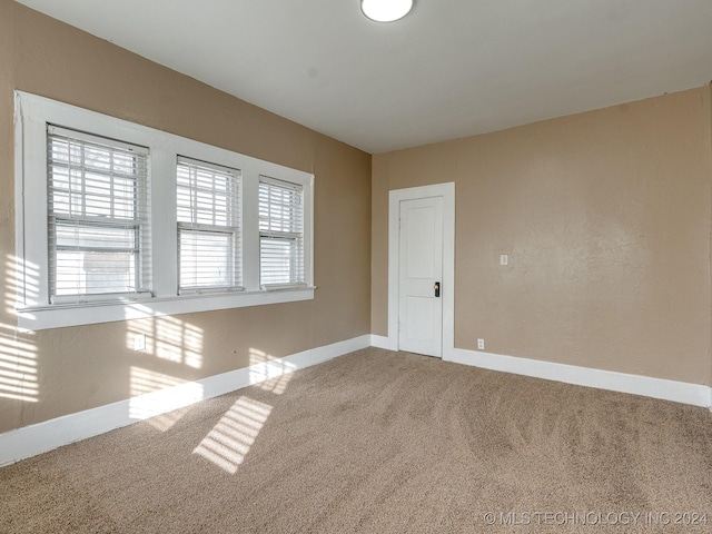 empty room with carpet flooring