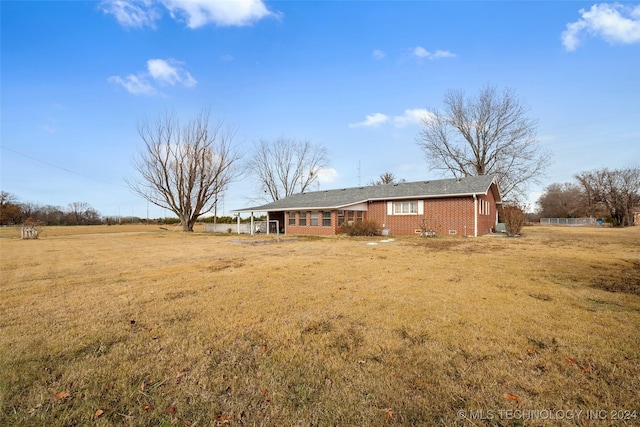 back of house with a yard