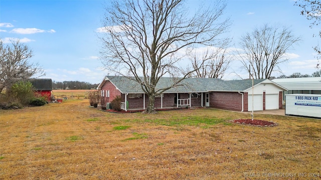 single story home with a carport and a front lawn