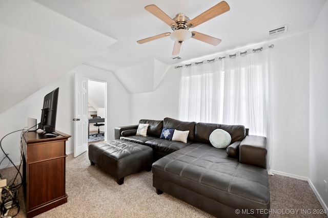 living room with ceiling fan, light colored carpet, and lofted ceiling