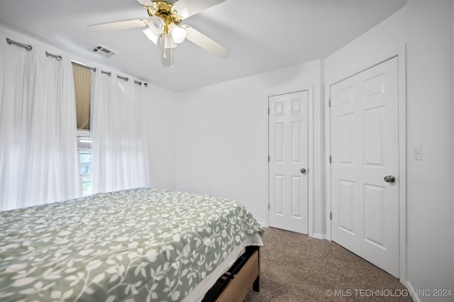 carpeted bedroom featuring ceiling fan