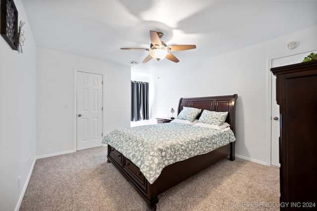 bedroom with light carpet and ceiling fan