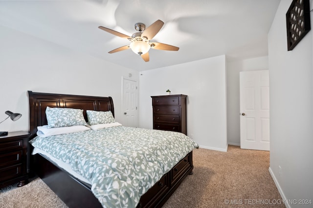 bedroom with ceiling fan and light colored carpet