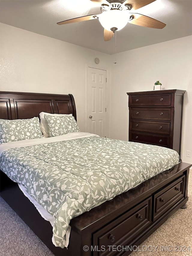 bedroom with light carpet and ceiling fan