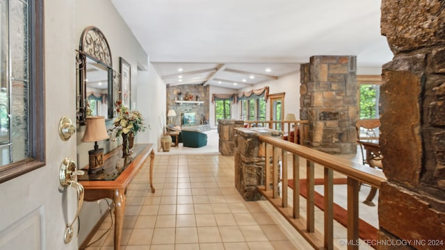 corridor featuring lofted ceiling with beams and light tile patterned flooring