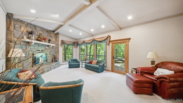 carpeted living room featuring vaulted ceiling with beams and a stone fireplace