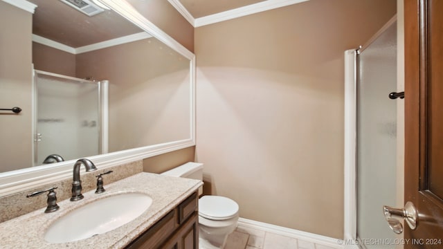 bathroom featuring vanity, tile patterned floors, toilet, ornamental molding, and walk in shower