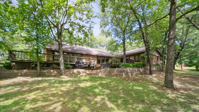 view of yard featuring a wooden deck