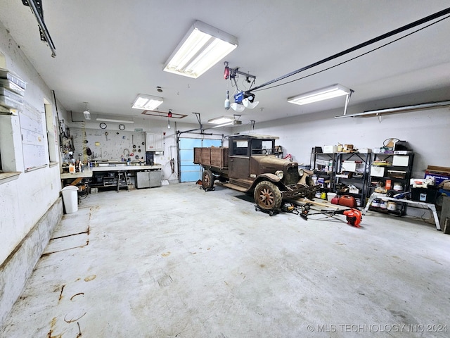 garage featuring a workshop area and a garage door opener