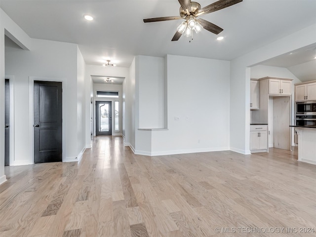 unfurnished living room with light hardwood / wood-style floors and ceiling fan