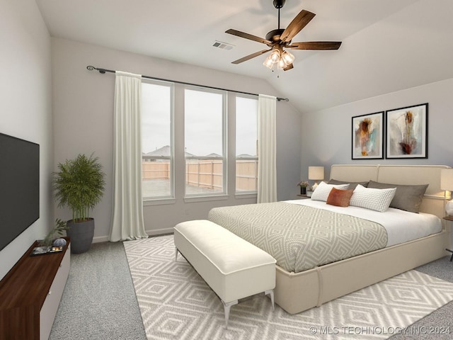 bedroom featuring ceiling fan, lofted ceiling, and light carpet