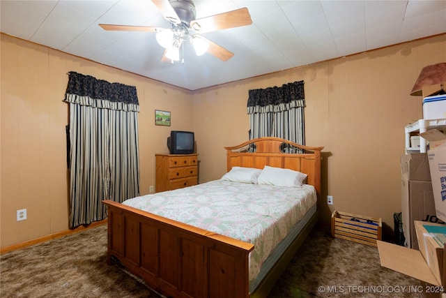 bedroom with dark carpet and ceiling fan